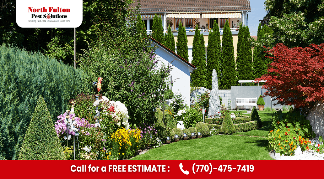 Shaded garden bed with spaced plantings and airflow around a Cumming-area home