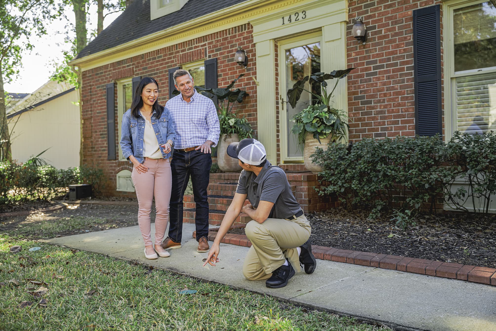 Person guiding couple about pest control